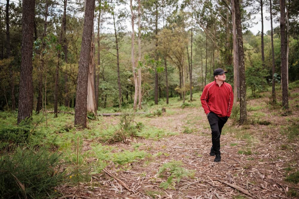 Man walking in the woods after getting cocaine addiction treatment in New Jersey