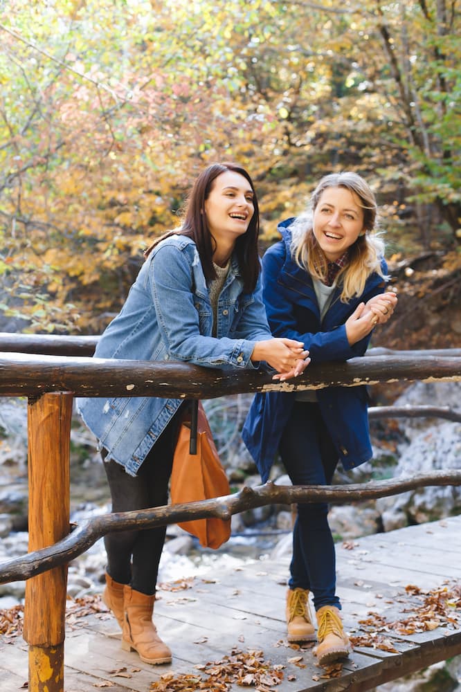 Two women happy outside after receiving substance abuse treatment in New Jersey