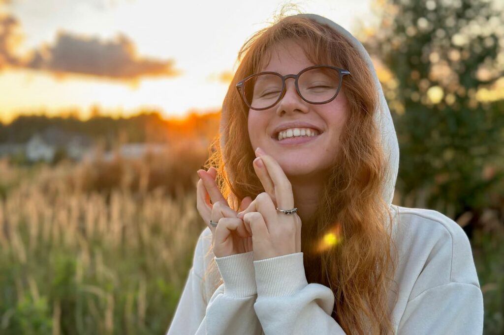A teenage girl outside happy after her adolescent BPD treatment in NJ